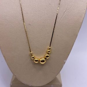 Lovely gold tone necklace